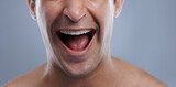 Man, mouth and clean shave with laughing, lips and hygiene with jawline, satisfaction and treatment closeup. Grooming, confidence and face with male model in studio background for cosmetic smile