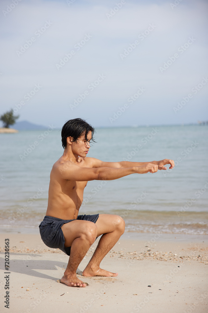 Active Lifestyle: Muscular Asian Man Running on the Beach at Sunset Active Lifestyle: Muscular Asian Man Running on the Beach at Sunset