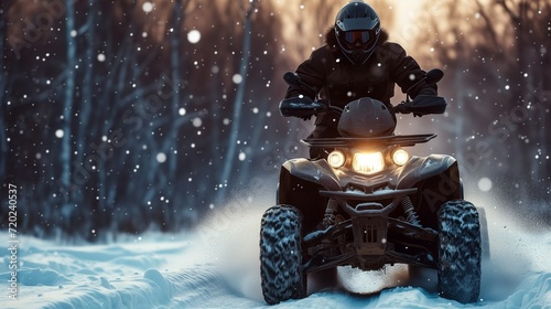 A man riding through the snow in winter on an ATV, a motorcycle ride on a four-wheeled bike