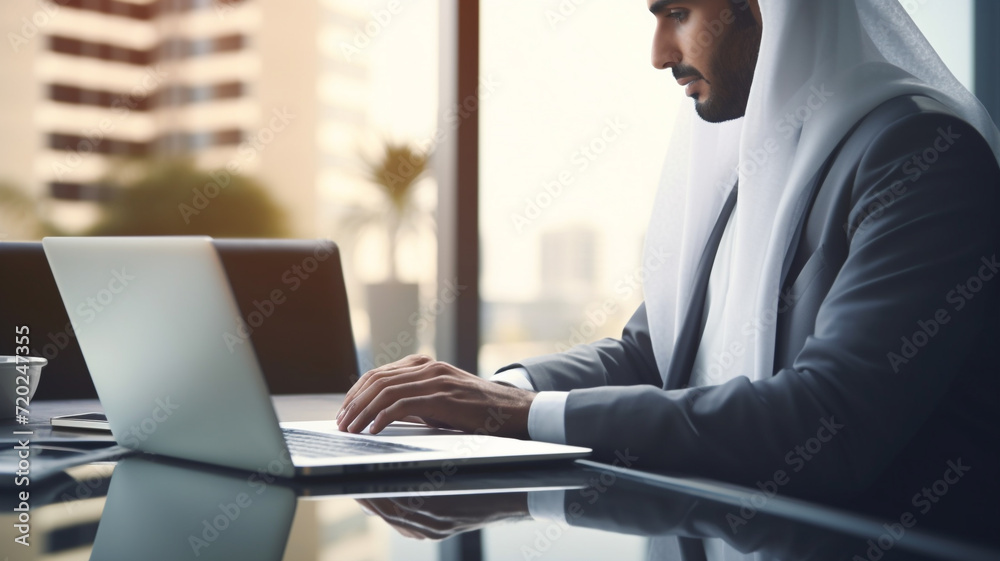 arab man working on a laptop in office arab man working on a laptop in office