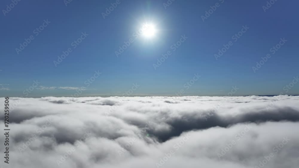 Blue Sky Above the clouds scenery. Sunrise foggy morning landscape. Flying inside clouds. Rays of sun above the clouds. Sunlight weather. Sunrise scenery. Blue Sky Above the clouds scenery. Sunrise foggy morning landscape. Flying inside clouds. Rays of sun above the clouds. Sunlight weather. Sunrise scenery.