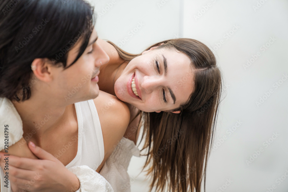 Beautiful young people having fun indoors Lovers at home celebrating Valentine's Day concept. Beautiful young people having fun indoors Lovers at home celebrating Valentine's Day concept.