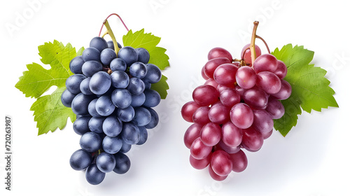Red and blue grapes with leaves isolated on white background..