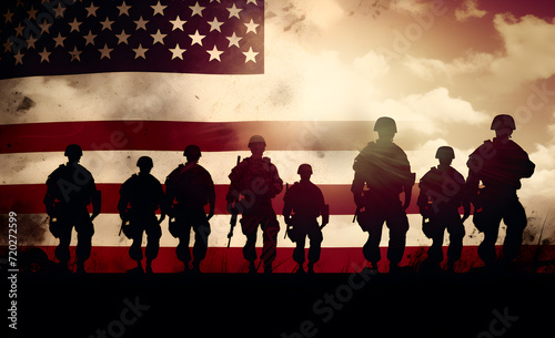 Silhouette of a soldier saluting the U.S. flag photo