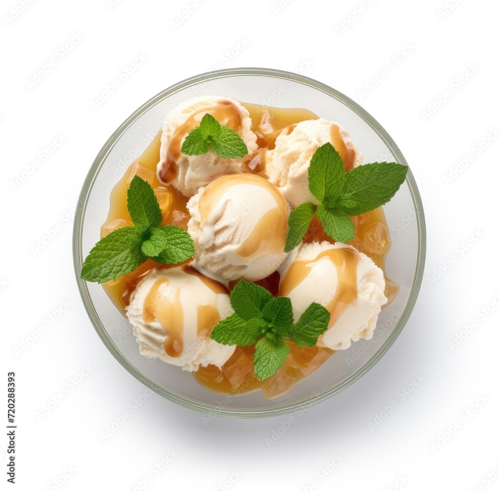 A glass bowl filled with creamy mint-flavored ice cream topped with fresh mint leaves. A glass bowl filled with creamy mint-flavored ice cream topped with fresh mint leaves.