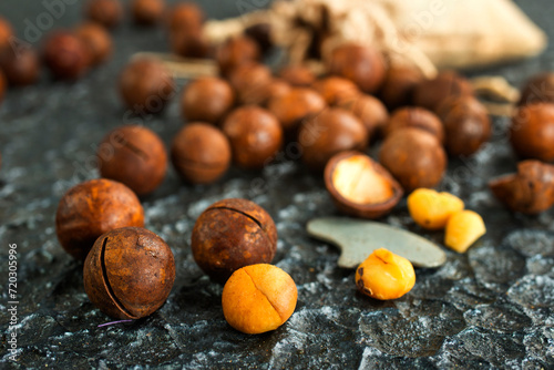 Organic Macadamia nut on wooden table, helthy food photo