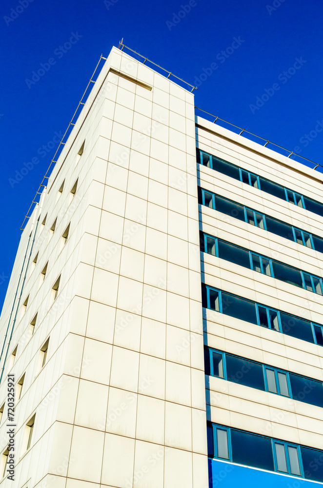 windows of an empty office business building during quarantine windows of an empty office business building during quarantine