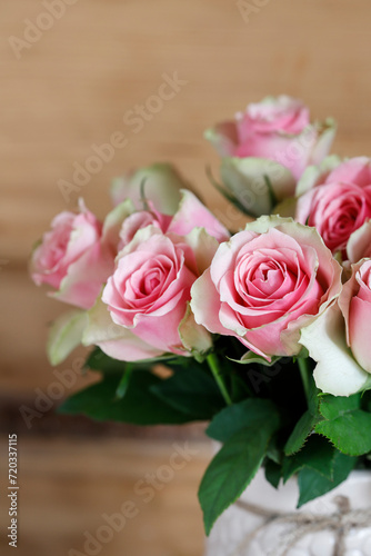 Bouquet of pink roses in a vase.
