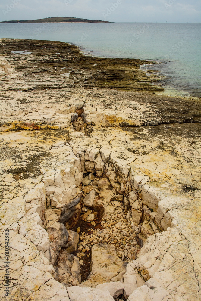 The rugged limestone landscape of the Kamenjak National Park on the Premantura peninsula in Medulin municipality, Istria, Croatia. December The rugged limestone landscape of the Kamenjak National Park on the Premantura peninsula in Medulin municipality, Istria, Croatia. December