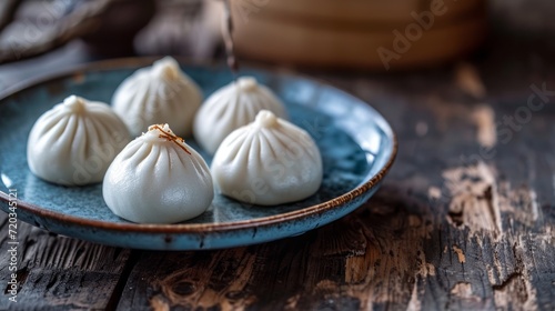 Elegant dim sum dumplings served in a traditional ceramic bowl.