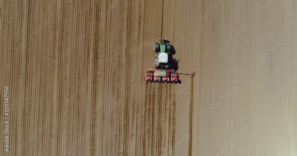 Aerial of tractor on harvest field ploughing agricultural field. Aerial of tractor on harvest field ploughing agricultural field.