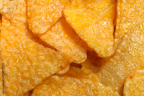 delicious chips. photo of nacho chips in the shape of triangles  close-up. snacks and fast food concept
