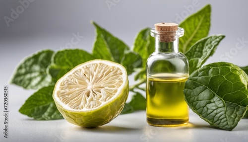 Lemon oil bottle with lemon and mint leaves