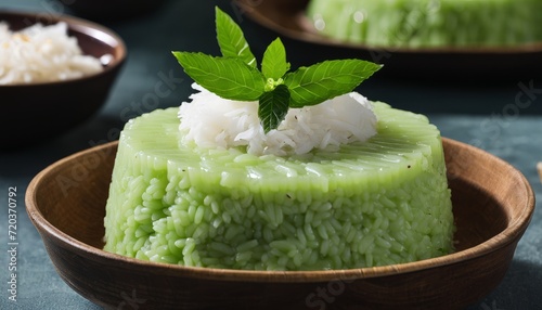 A green rice dish with a leaf on top photo