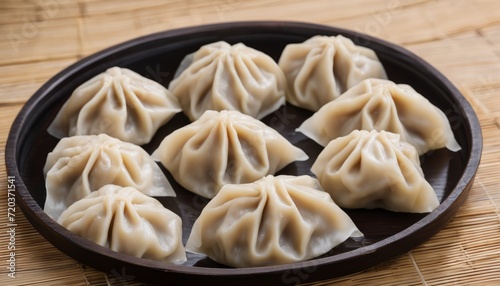 A plate of dumplings on a wooden table