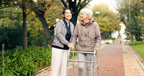 Obraz na plátne Senior woman, walker and nurse outdoor in a park with healthcare for elderly exercise