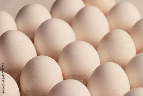 Macro detail of white eggs with warm light. Food concept.