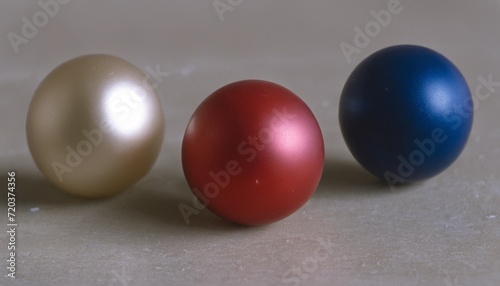 Three balls of different colors on a table