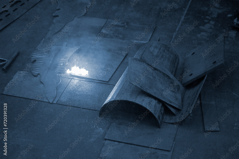 Laser cleaning of metal. The laser beam cleans the metal surface from