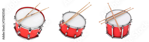 red bass drum with pair of drum sticks on a white background photo