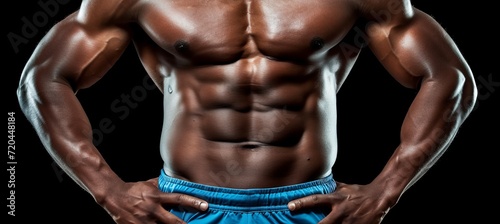 Muscular waist of male athlete in sportswear on black background fitness and gymnastics concept