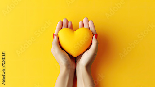 Women's Day. Adult Female Holding Yellow Hearts by Hand, Top View Studio Shot on Yellow Background