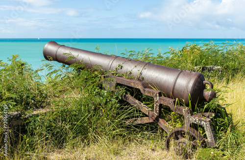 An ancient cannon pointed toward the harbor at Fort James on the island of Antigua in the Caribbean.