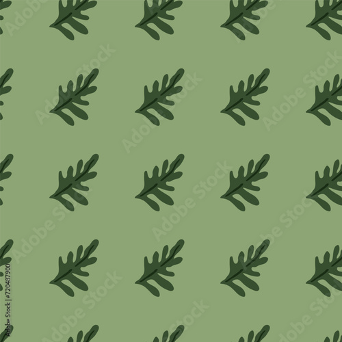 Lush green leaves and exotic plants in a seamless pattern.