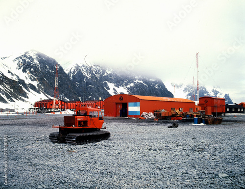 Base Orcadas Research Station, Laurie Island, South Orkney Islands, Antarctica. 01.2020. An Argentine research station, the oldest in Antarctica, with red buildings and Argentine flags.