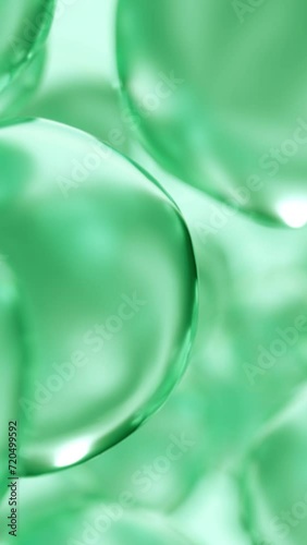 Essential cosmetic oil bubbles floating in water. Green liquid sphere shaped, fluid flow background. Moisturizing hydrating collagen cream. Skin care serum beauty care vitamin concept 3d animation