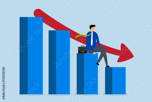 Economic recession, business owner seated on a falling down bar graph and a red arrow.