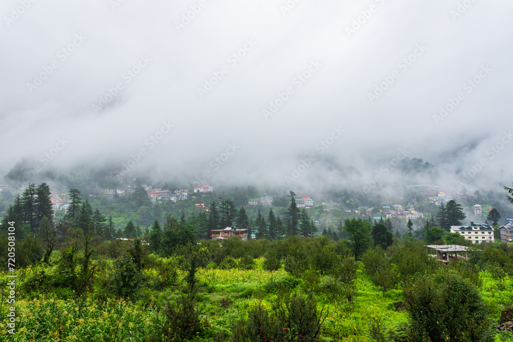 Old Manali town shrouded in misty clouds in Monsoon season. It is a popular Heaven for back packers and nature lovers for its natural beauty of Himalayas in Kullu region.