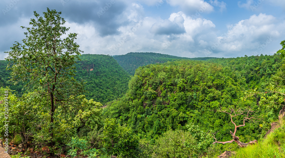 Panoramic view of Pachmarhi valley having clouds shrouded hills of Satpura range rolling on each other from vantage point in Pachmarchi, Madhya Pradesh, India.
