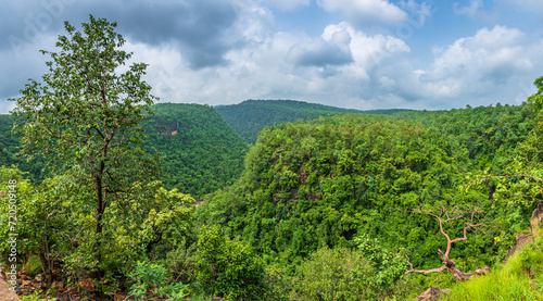 Panoramic view of Pachmarhi valley having clouds shrouded hills of Satpura range rolling on each other from vantage point in Pachmarchi  Madhya Pradesh  India.