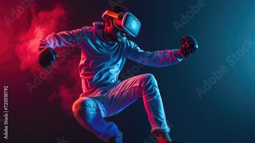 Gamer throwing a kick mid air while wearing virtual reality goggles. Sporty young man kickboxing in virtual reality. Active young man exploring immersive 3D games in a studio
