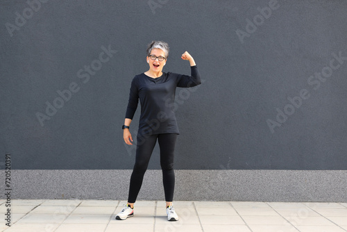 A fit and active woman engaging in outdoor fitness, running, and practicing stretching exercises in an urban environment, promoting a healthy and energetic lifestyle. © Andrii Zastrozhnov