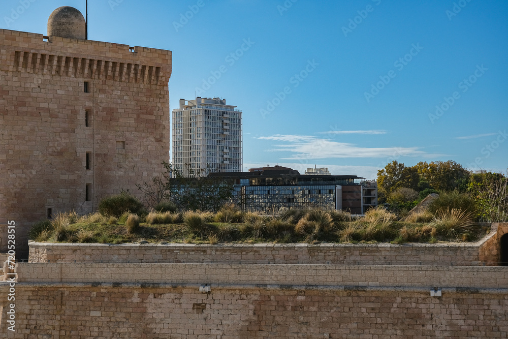 Romantic backstreet, side street or alleys in historic old town of Marseille Provence, France with Mediterranean style architecture facades, a landmark sightseeing tourist spot in downtown scenic view