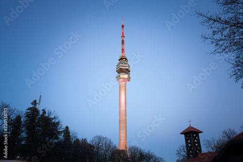 Avala tower, or Avala toranj, seen from below. It is a TV tower and broadcasting antenna in the suburbs of Belgrade, Serbia. photo