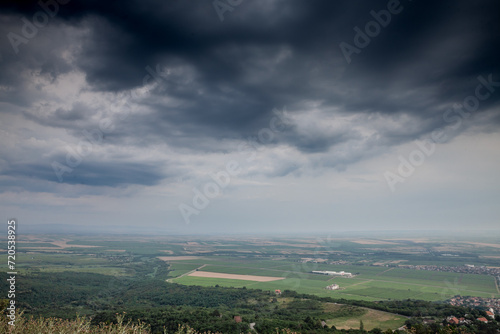 Picture of the plains of Vojvodina seen from vrsacki breg during a rainy afternoon. The Vršac Mountains, also known as Vršac Hill, are located in the Banat region near the city of Vršac, Serbia and pa photo