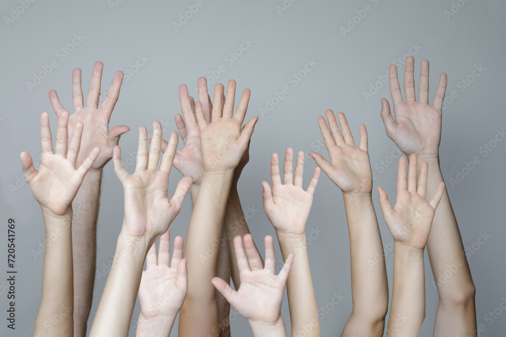 Many hand palm up on gray background. Volunteer, people, support and agreement concept Many hand palm up on gray background. Volunteer, people, support and agreement concept