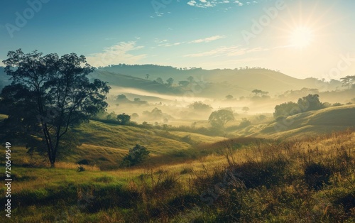 A serene countryside with rolling hills and morning mist © sitifatimah