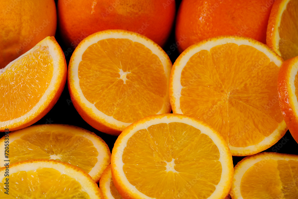 Sliced orange slices shot in macro photography on a black background Sliced orange slices shot in macro photography on a black background