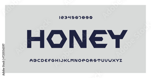 Honey Font. Letters and numbers for honey logo, branding, company and label design. Hexagon honeycomb cell style. Symbol of honey bee. Geometric Alphabet. Abstract background. photo