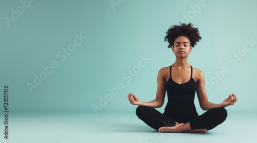 A serene yoga instructor in a peaceful pose, radiating calmness and tranquility. photo