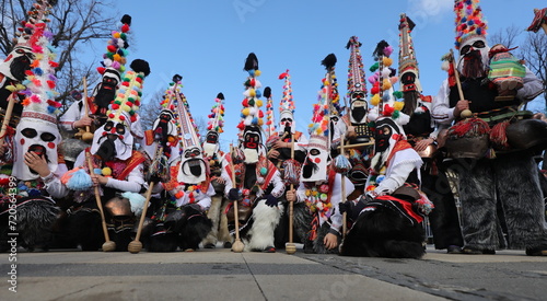 Pernik, Bulgaria - January 26, 2024: International masquerade festival Surva in Pernik, Bulgaria. People with mask called Kukeri dance and perform to scare the evil spirits.