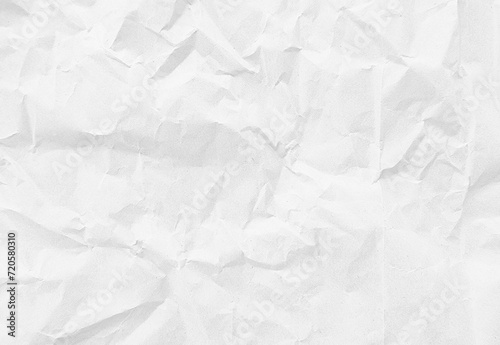 close up texture of white crumpled or torn craft paper use as background with blank space for design. creased recycle white craft paper texture. photo