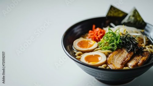 Side view of a Tokyo Shoyu Ramen against white background