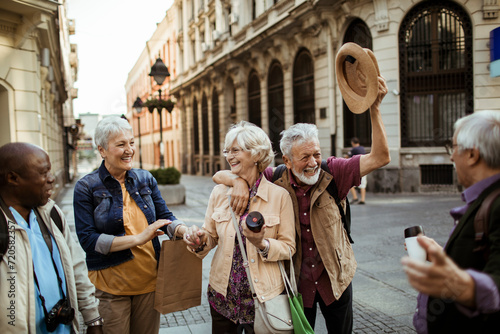 Diverse senior people having fun in city on vacation