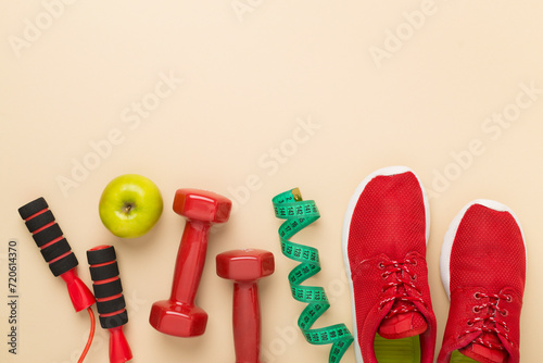 Sport equipment with tape measure on color background, top, view © Liami