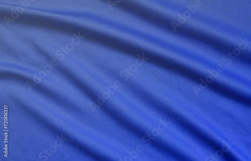 Detailed polyester blue fabric texture with many long folds